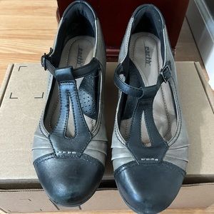 Women’s earth Mary Jane type pumps.